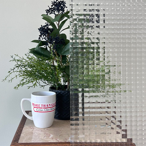 Cross Reeded Cabinet Door Glass With Grid Texture Partially Obscuring Plant – More Than Glass