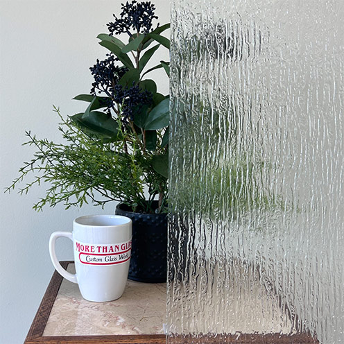 Textured Rain Cabinet Door Glass With Streaked Pattern Obscuring Plant – More Than Glass